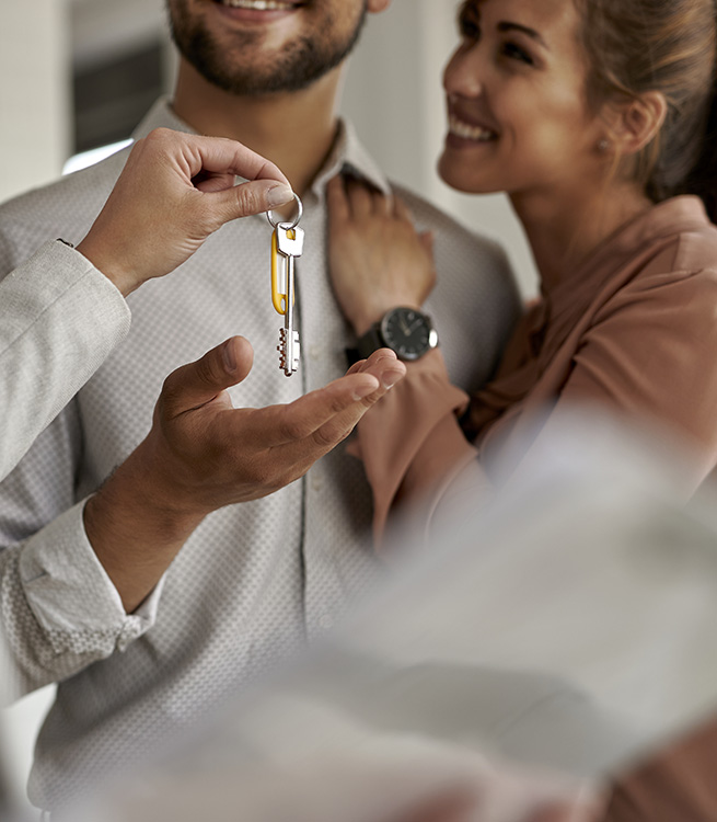 close-up-of-real-estate-agent-giving-house-keys-to-2023-01-06-20-36-12-utc4